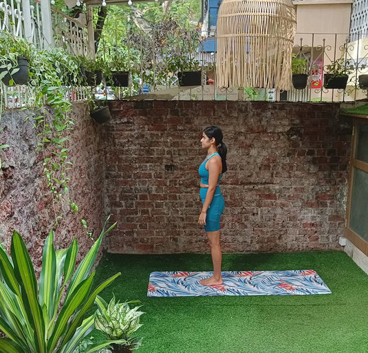 Yoga Teacher on tropical print mat by kosha yoga co