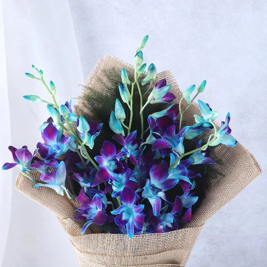 FNP- Blue Orchids Beautifully Tied Bunch