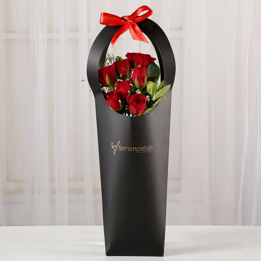 FNP- Ravishing 7 Red Roses in Black Sleeve