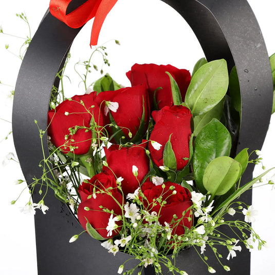 FNP- Ravishing 7 Red Roses in Black Sleeve