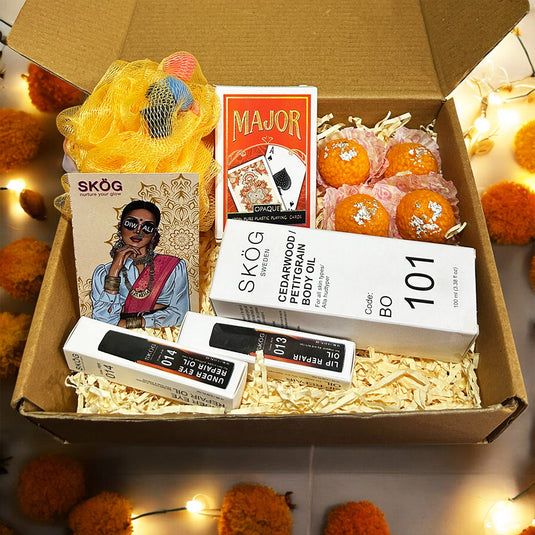 CHAKRI GLOW BOX with SKOG Under Eye Repair Oil, Lip Repair Oil, Cedarwood Body Oil, Diwali playing cards, laddu candles, Loofah and custom Diwali wish card - Luxurious Diwali Gift