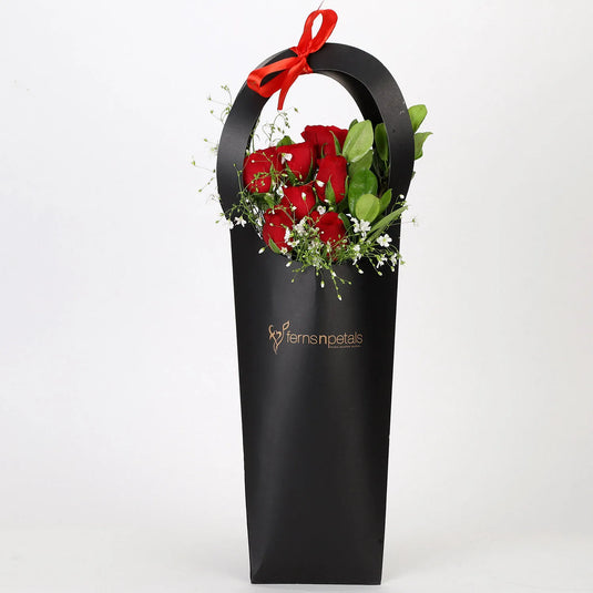 FNP- Ravishing 7 Red Roses in Black Sleeve